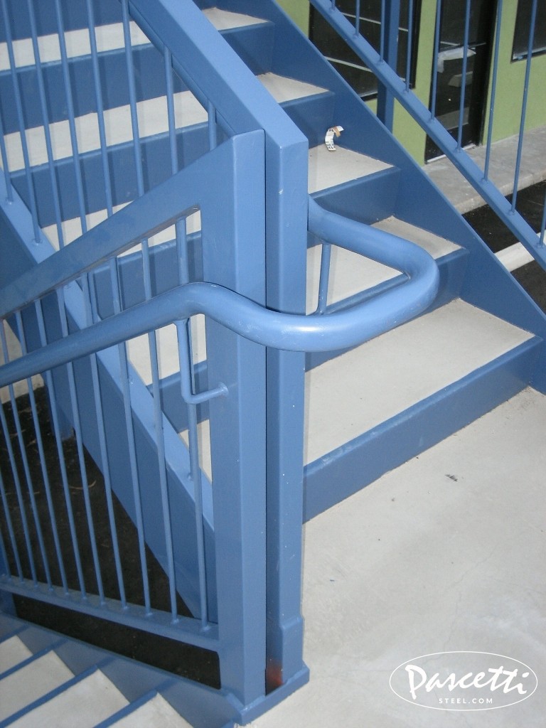 commercial stair and cable rail system with blue steel frame and concrete treads