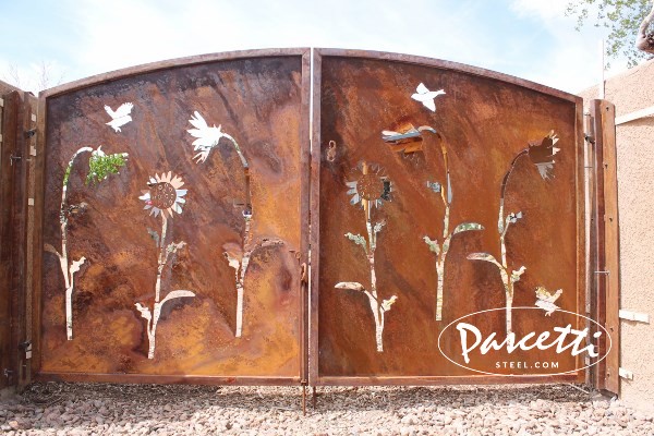 gates rusted custom steel sunflowers birds residentialGates Gates do much more than provide security and privacy; they also add beauty to homes and landscapes. Whether it's a simple steel picket gate for a patio, or one of our custom forged ornamental steel gates, we'll help you select the right gate and latch combination for your setting. Our plasma cut driveway gates are fabricated entirely by hand from raw material to finished product, preserving the human element of a trade thousands of years in the making. Every individual gate is unique in its own way. Gate designs for courtyards, patios, entries, pools and more A range of styles from steel picket, security, custom designed and gates for ornamental garden fencing. Choose from several latch styles to suit your needs. Any style can be converted to a pool gate with self-closing hinges and locks to meet code and safety requirements. Top corners of all gates are mitered, welded, and sanded smooth. Plastic caps are never used at Pascetti Steel.