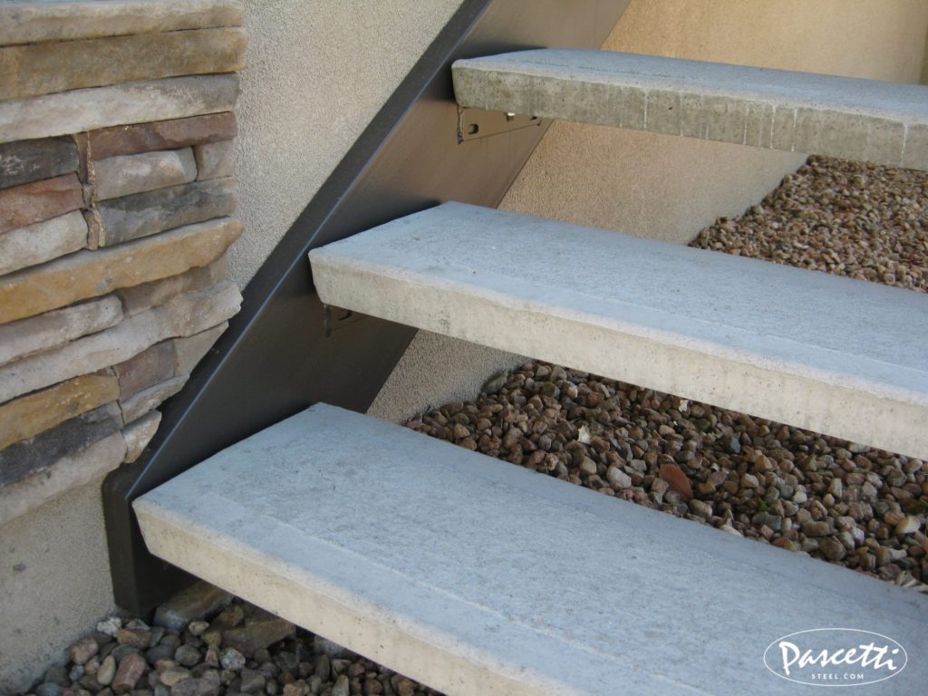 Mechanically attached concrete treads with hidden attachment brackets