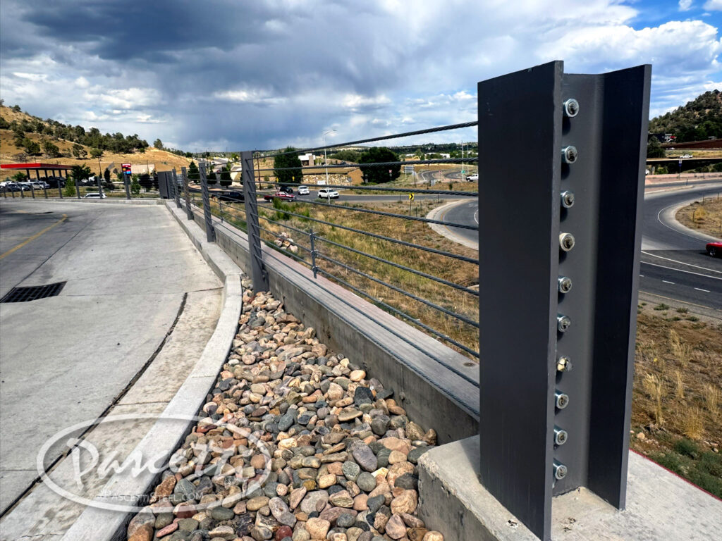 Crash-tested business parking lot drive thru high tension cable barrier system securing vehicles