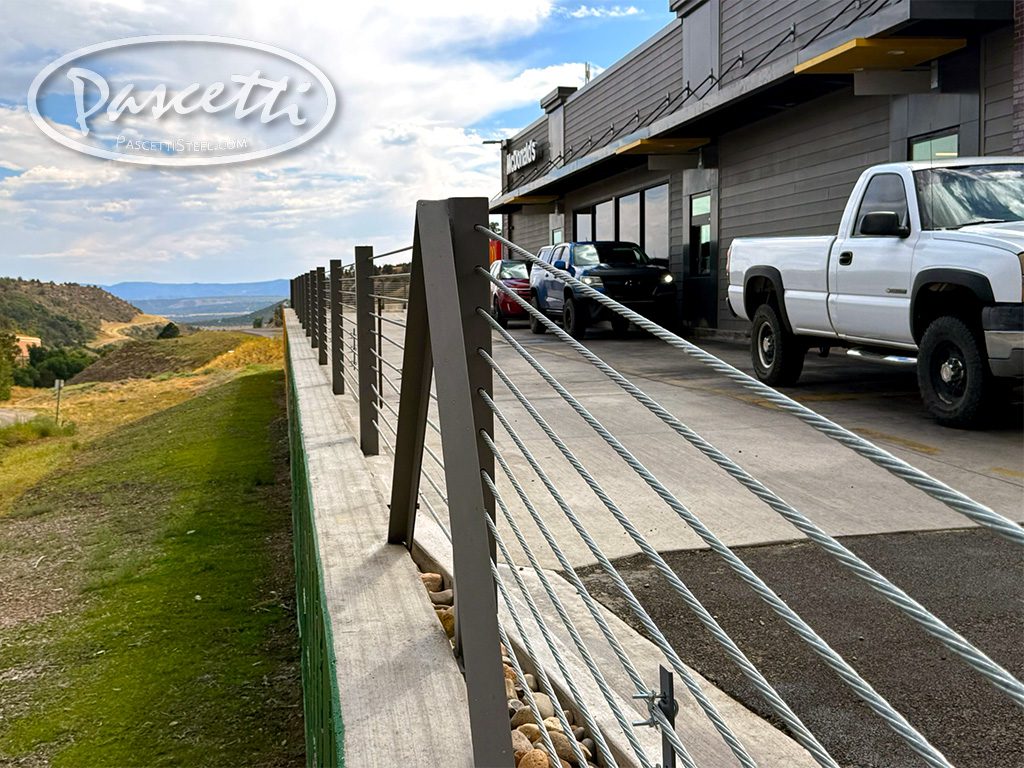 Parking lot vehicle high tension cable barrier system for impact protection