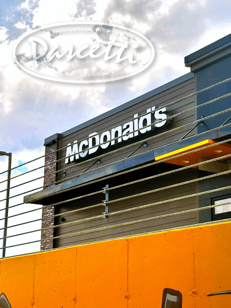 Vehicle roadway high tension cable barrier system for traffic safety ay McDonalds Drive Thru in Durango Colorado