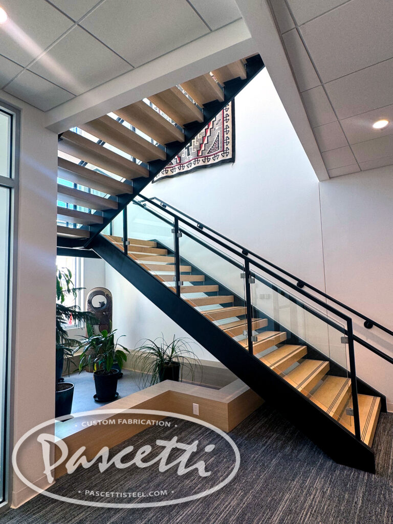 completed stair with wood treads and glass rail