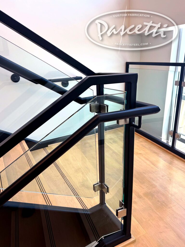 Custom fabricated railings with half inch glass panel infill. Cantilevered Stairs with Glass Railing