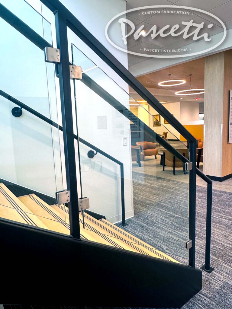 1/2" Tempered Glass Panels with Stainless-Steel Brackets. Cantilevered Stairs with Glass Railing